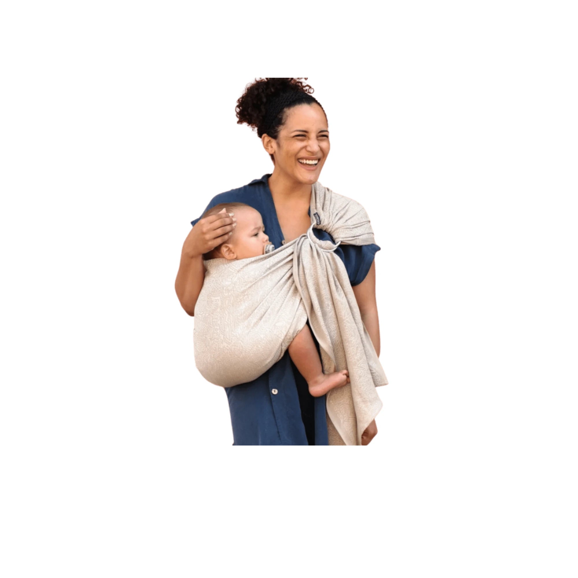 Smiling mother using a DidySling ring sling, comfortably carrying her baby in a stylish and supportive organic cotton ring sling