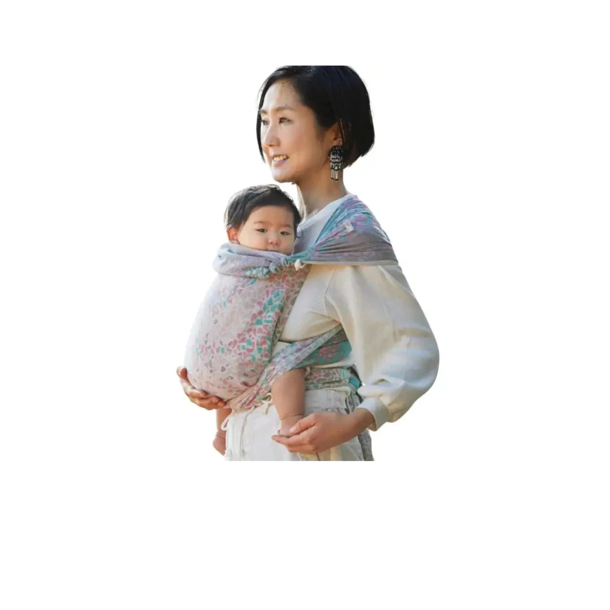 Mother wearing a Didymos Mei Tai DidyTai, an easy-to-tie wrap baby carrier made from soft Didymos woven wraps, holding their baby snug and cozy