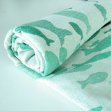 Swirling Fishes Emerald Half linen Blanket by Didymos